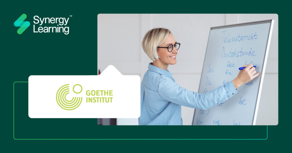 Frau schreibt auf einem Whiteboard in Deutsch