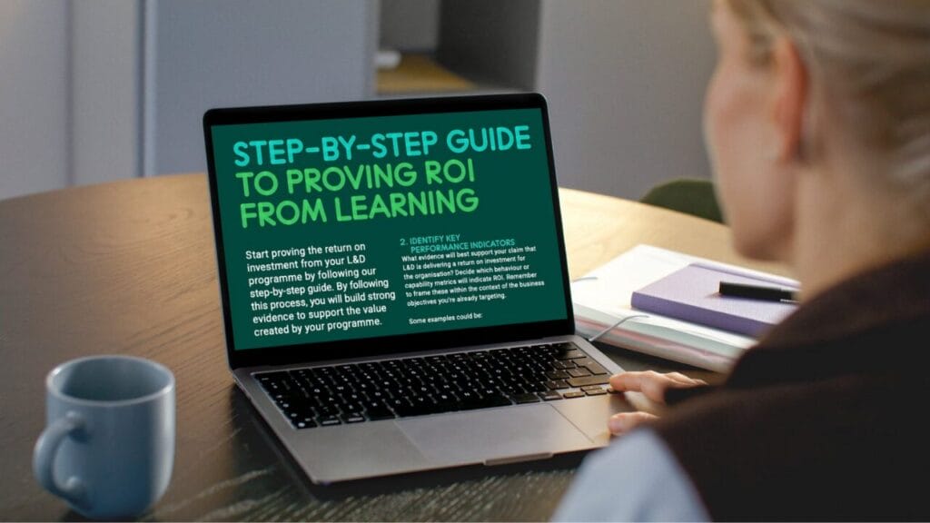 Women on laptop looking at how to prove the return of investment with synergy learning guide