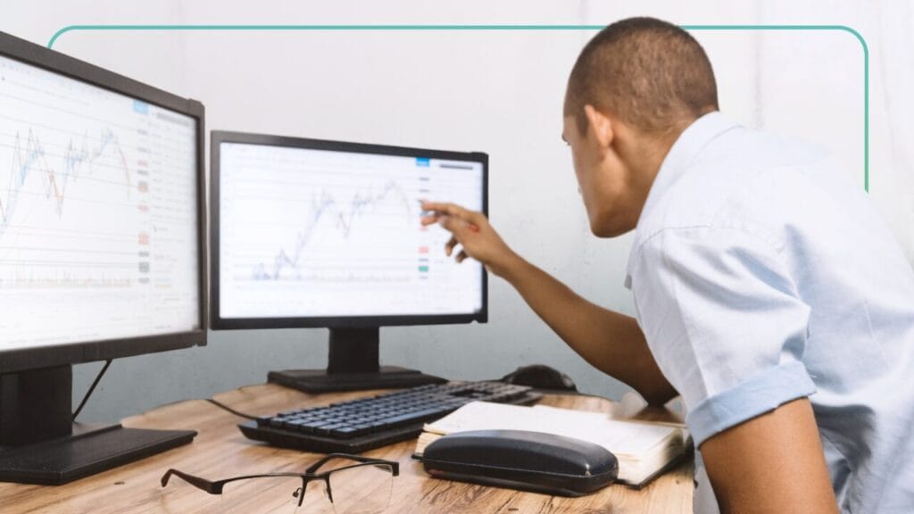 man reviewing compliance learning data on a learning management system - Synergy Learning
